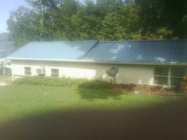 Blue metal roof running the length of a single story home in Thompsons Station